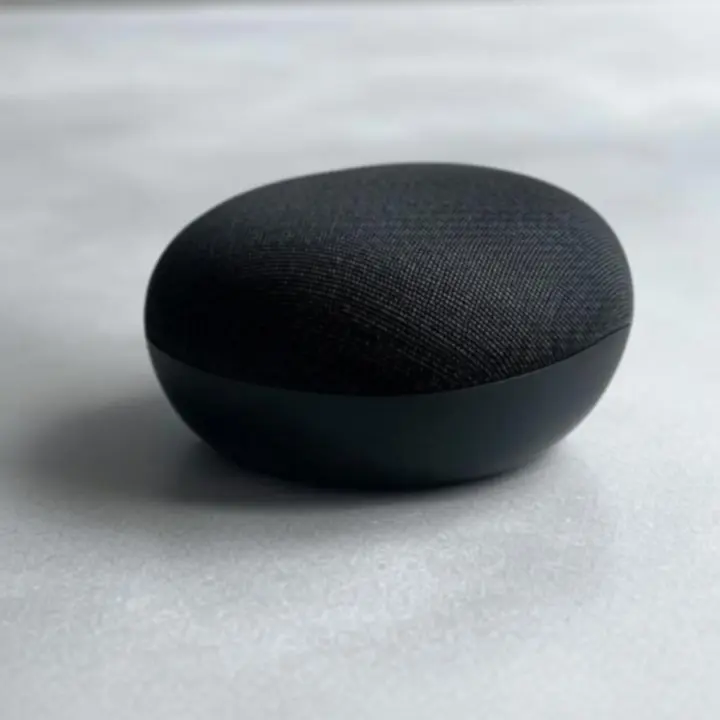Close-up of a premium smart speaker with touch controls.